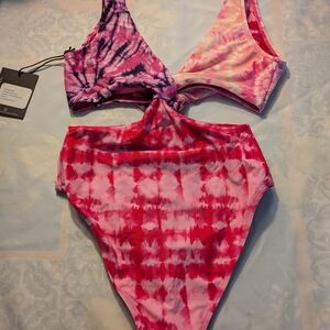 Vibrant Pink and Purple One Piece Swimsuit with Modern Cutout